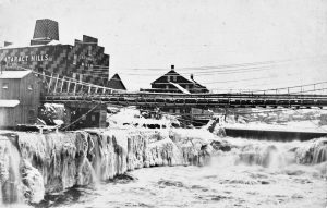 Mill Street Suspension Bridge and Catarac Mills Winter Time -